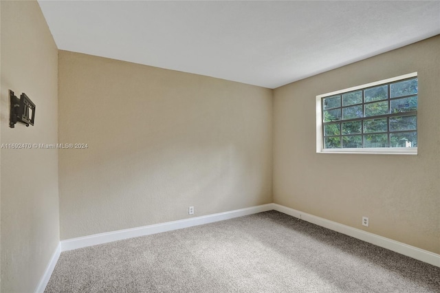 empty room with carpet flooring