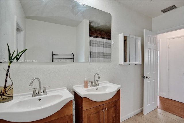 bathroom featuring hardwood / wood-style floors and vanity