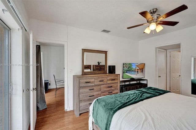 bedroom with ceiling fan and light hardwood / wood-style flooring