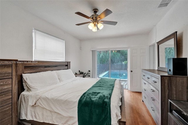 bedroom with access to exterior, ceiling fan, and light hardwood / wood-style flooring