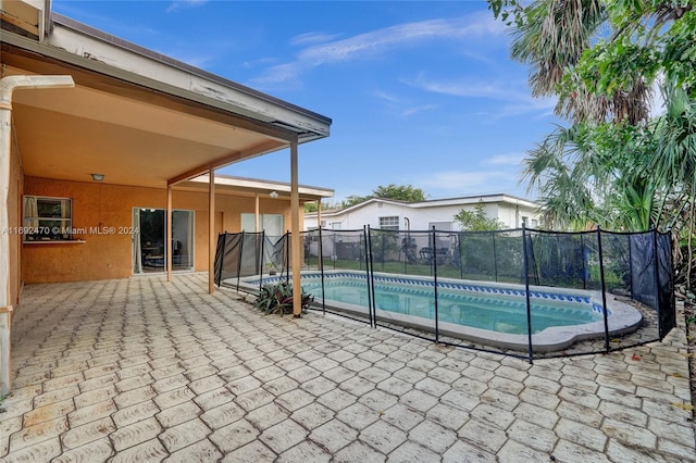 view of pool featuring a patio area