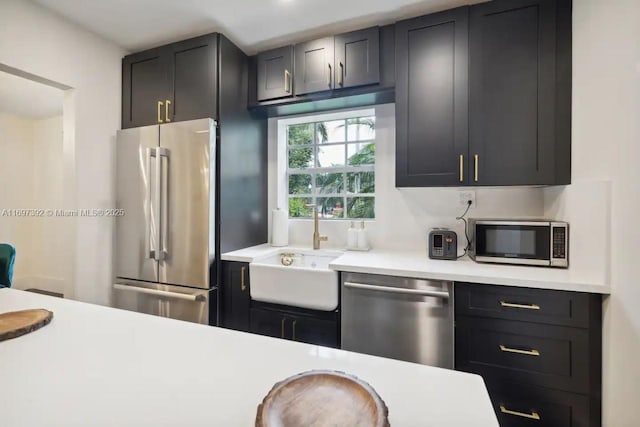 kitchen with appliances with stainless steel finishes and sink