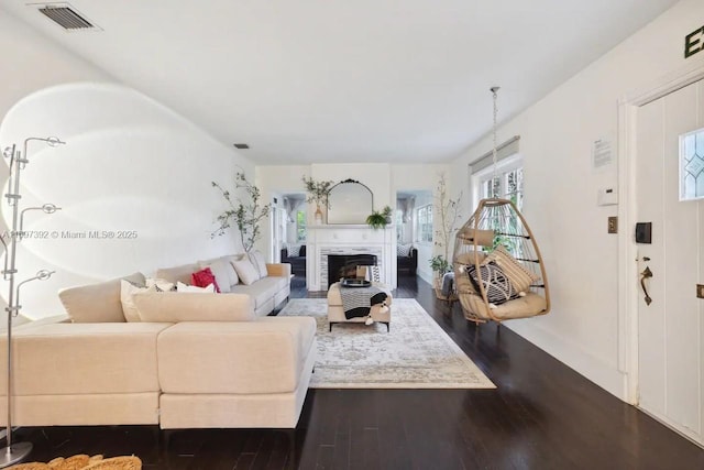 living room featuring dark hardwood / wood-style flooring