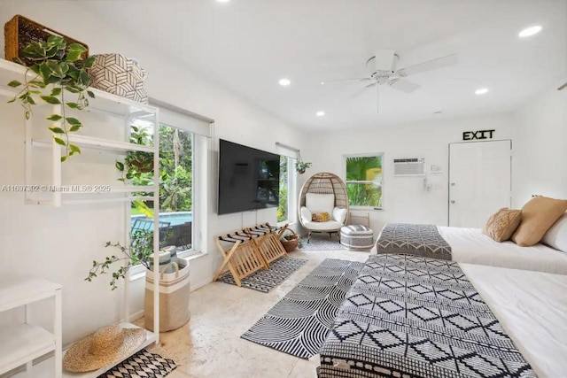 interior space featuring ceiling fan and a wall mounted air conditioner