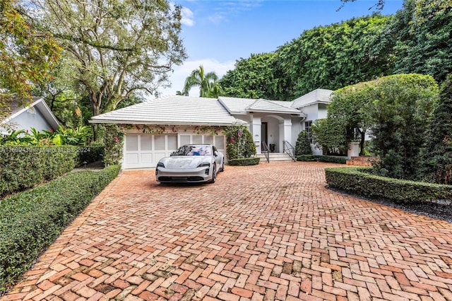 single story home featuring a garage