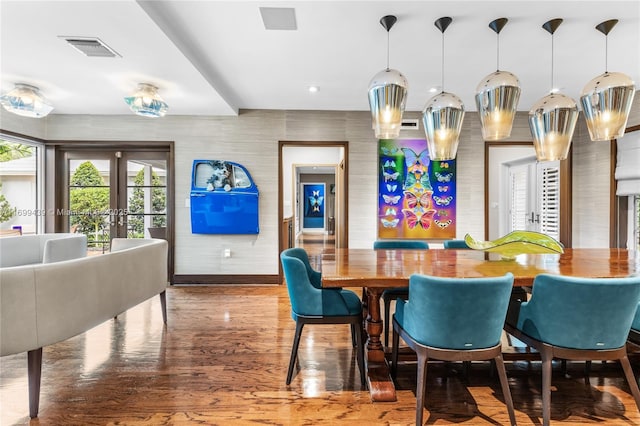 dining area featuring hardwood / wood-style flooring and french doors