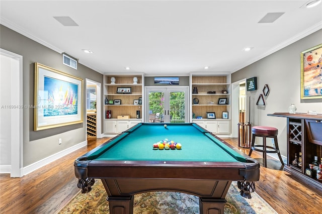 game room featuring crown molding, built in features, wood-type flooring, pool table, and french doors