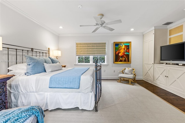 bedroom featuring ceiling fan, ornamental molding, and wood-type flooring