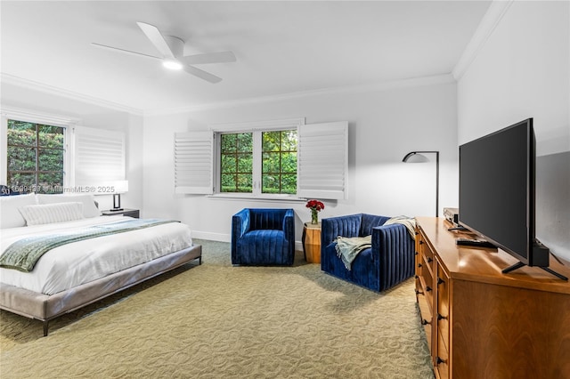 bedroom with ceiling fan, ornamental molding, and carpet