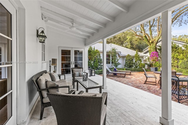 view of patio featuring french doors, ceiling fan, and an outdoor living space