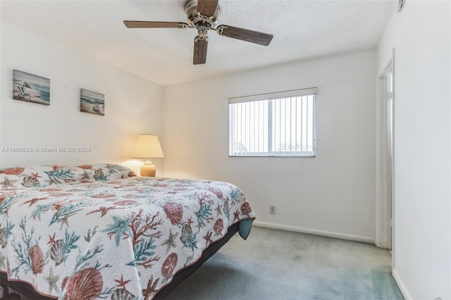 bedroom featuring ceiling fan and light colored carpet