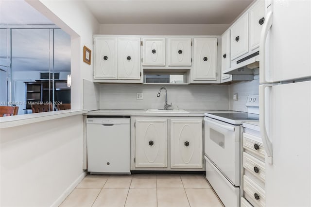 kitchen with white cabinetry, sink, and white appliances