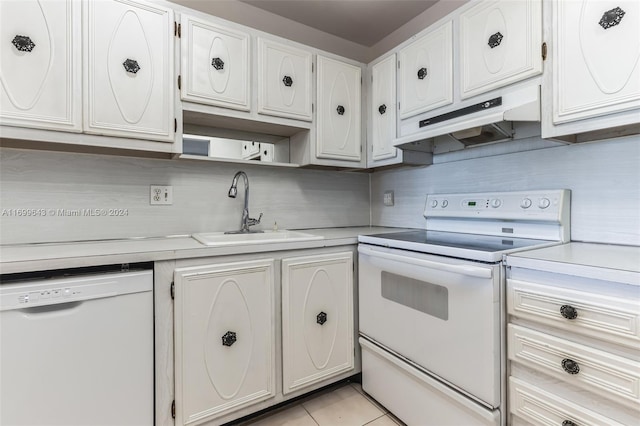 kitchen with white cabinetry, sink, backsplash, white appliances, and light tile patterned floors