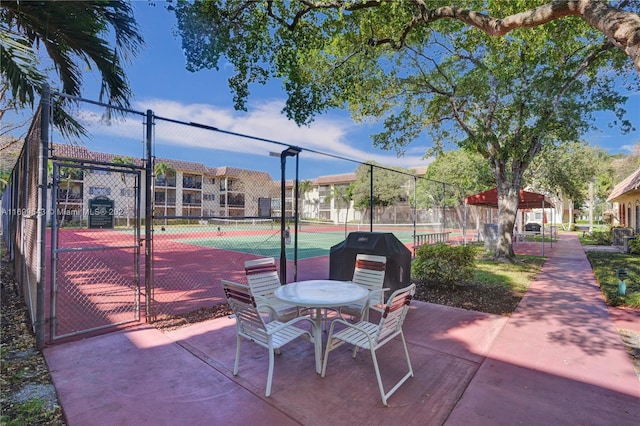 exterior space with tennis court