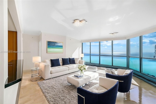 living room with expansive windows, ornamental molding, and a water view