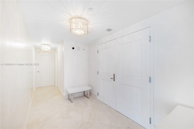 living area with an inviting chandelier