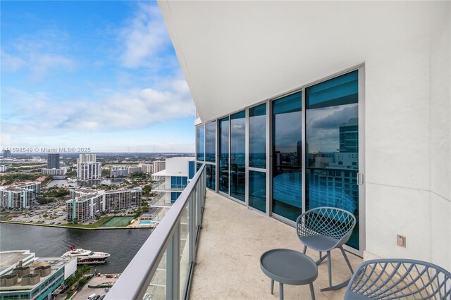 balcony featuring a water view