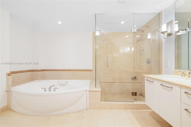 bathroom with vanity, tile patterned floors, and independent shower and bath