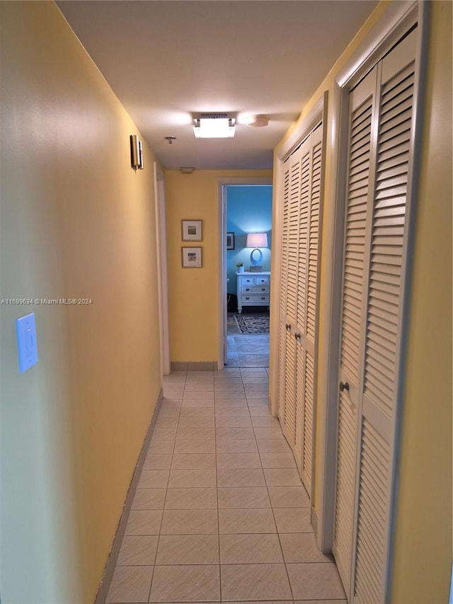 hallway featuring light tile patterned flooring