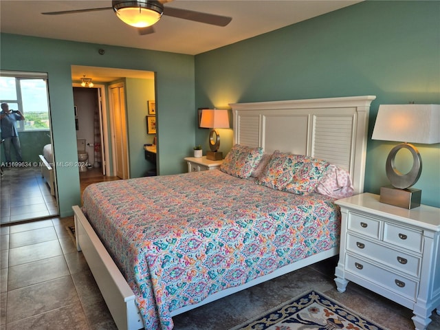 tiled bedroom with ceiling fan