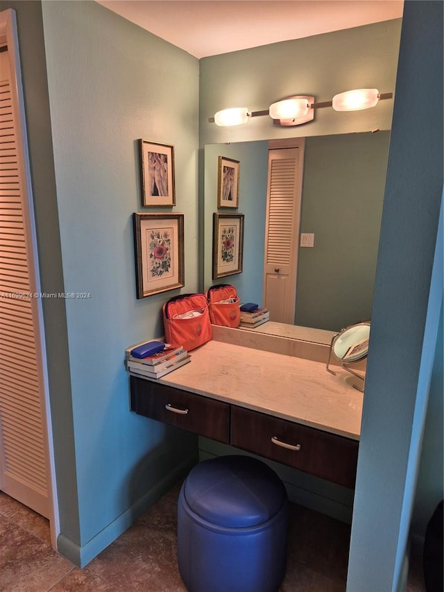 bathroom with tile patterned flooring and vanity