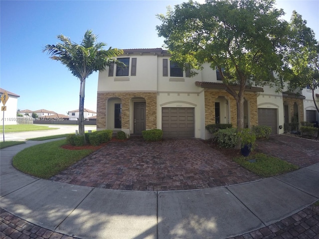 mediterranean / spanish-style house featuring a garage