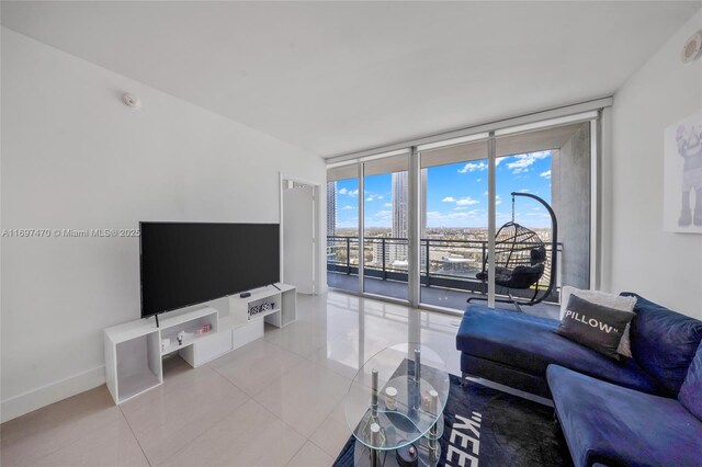 living room featuring light tile patterned floors and expansive windows