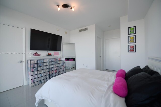 tiled bedroom with visible vents