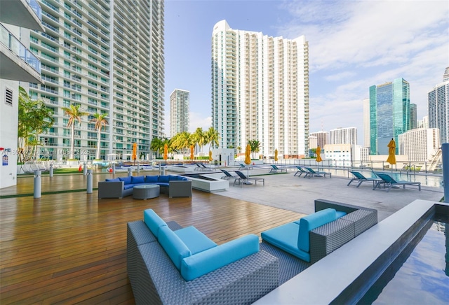 view of patio / terrace featuring a view of city and outdoor lounge area