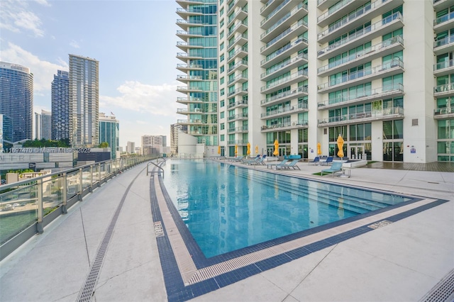 view of swimming pool with a view of city