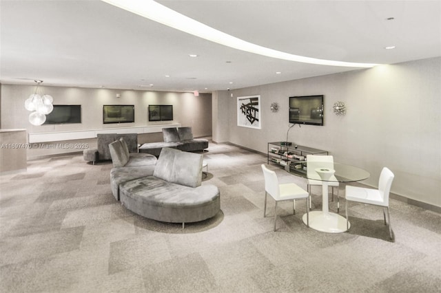 carpeted living area featuring recessed lighting and baseboards