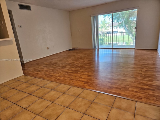 spare room featuring light wood-type flooring