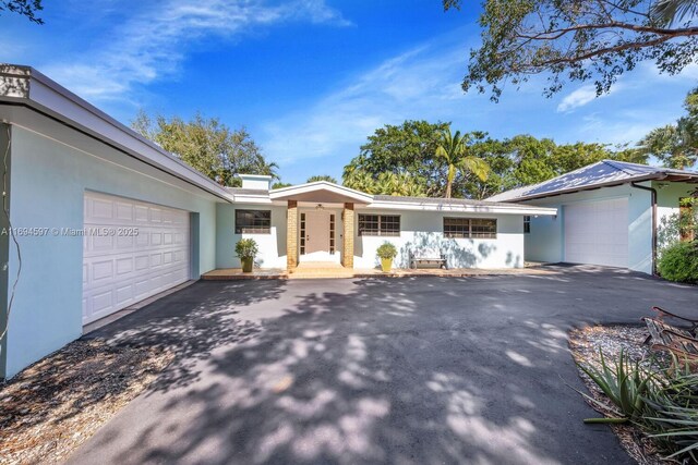 6065 SW 133rd St, Pinecrest, FL 33156 - living area featuring french doors, wood finished floors, baseboards, and a ceiling fan