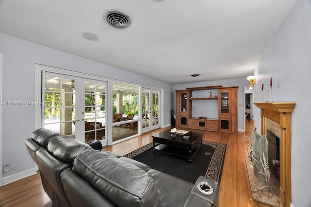 6065 SW 133rd St, Pinecrest, FL 33156 - kitchen featuring a sink, appliances with stainless steel finishes, a kitchen island, white cabinetry, and light wood finished floors