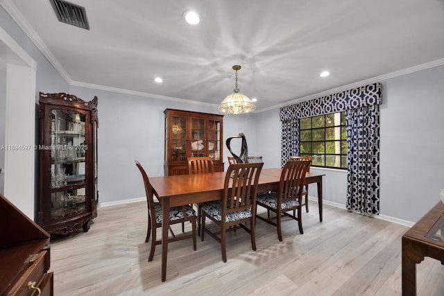 6065 SW 133rd St, Pinecrest, FL 33156 - dining space featuring light wood-style flooring, crown molding, recessed lighting, baseboards, and a chandelier