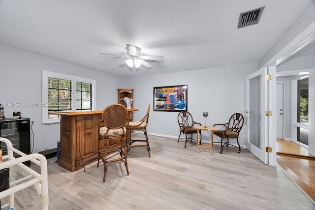 6065 SW 133rd St, Pinecrest, FL 33156 - indoor dry bar with light wood-type flooring, ceiling fan, and baseboards