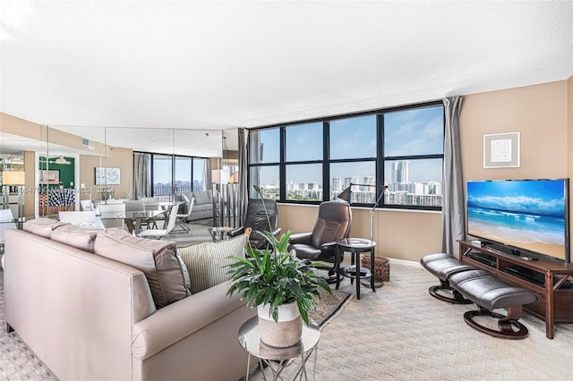 living room featuring light colored carpet and a textured ceiling