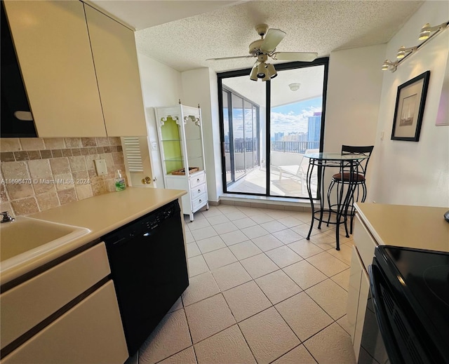 kitchen featuring black appliances, sink, ceiling fan, a textured ceiling, and light tile patterned flooring