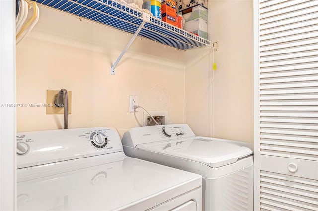 washroom featuring independent washer and dryer