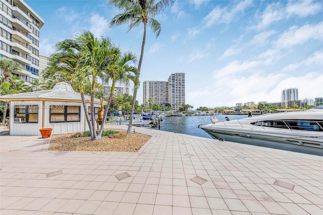 exterior space featuring a water view and a boat dock