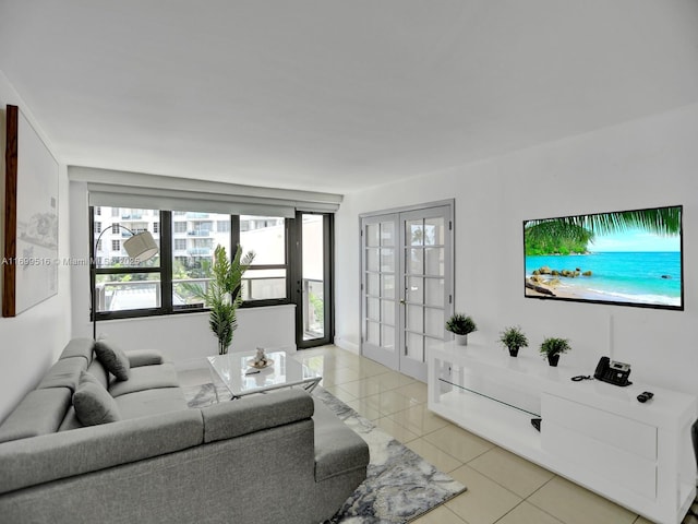 living room featuring french doors and light tile patterned floors