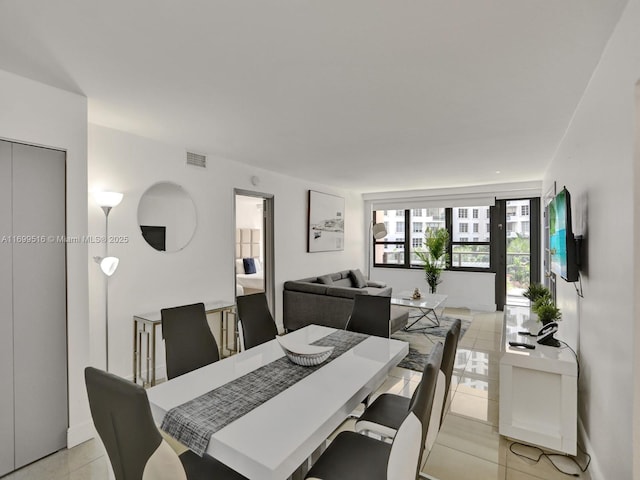 dining area featuring light tile patterned floors