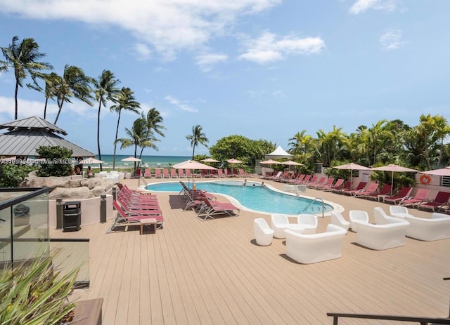 view of pool with a gazebo and a water view