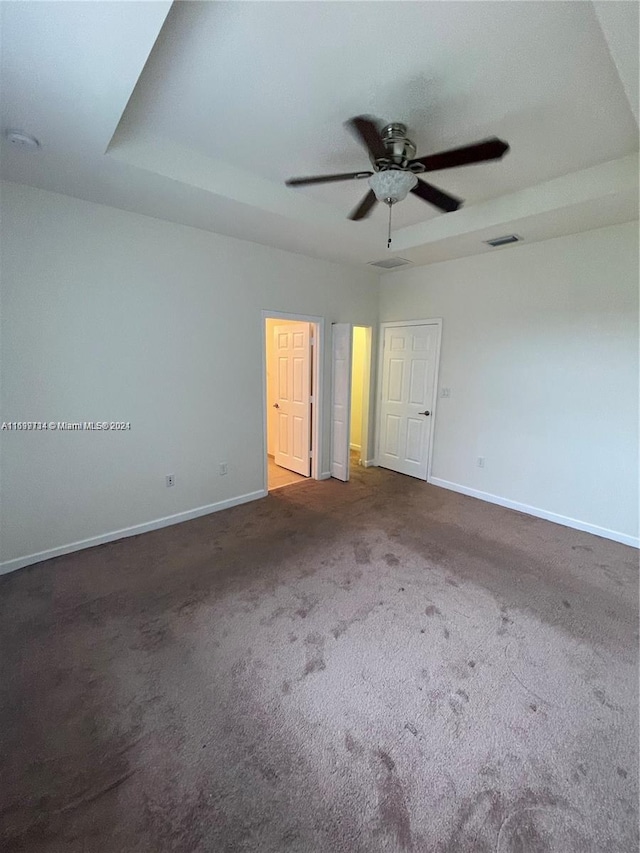 carpeted empty room with ceiling fan