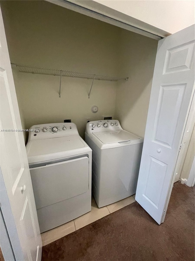 washroom featuring carpet flooring and separate washer and dryer