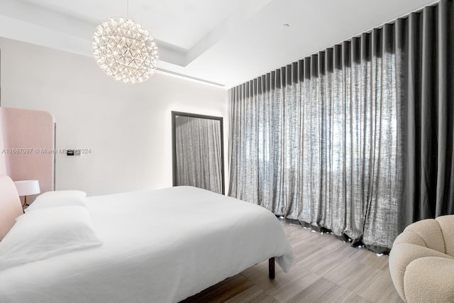 bedroom featuring a chandelier