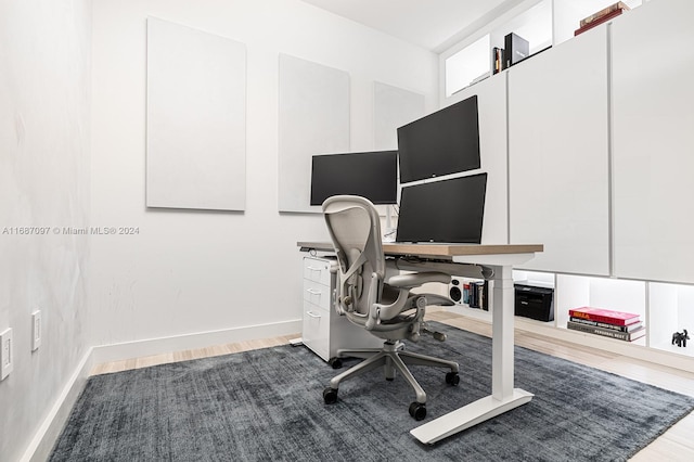 office with wood-type flooring