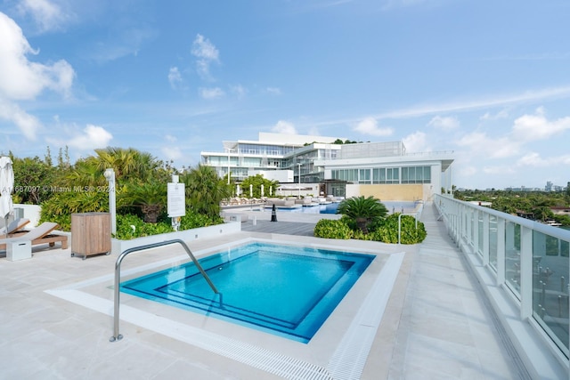 view of pool featuring a community hot tub