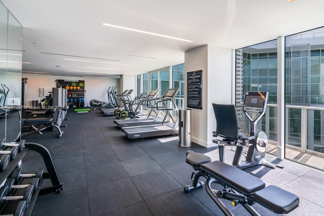 exercise room with floor to ceiling windows