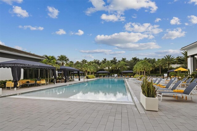 8067 White Wave Ter, Boca Raton, FL 33496 - community pool with a gazebo, a patio area, and an outdoor hangout area